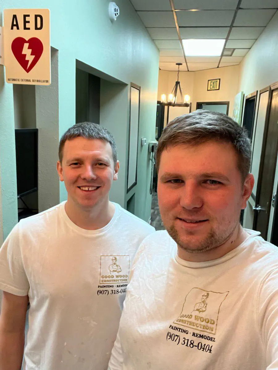 Two ReSpace Construction team members in branded shirts during a remodel
